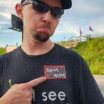 Photo of Tyler with a Media (press) badge on his shirt