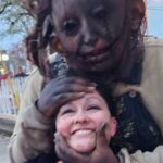 Photo of Nora interacting with a haunt actor