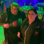 Photo of Nora getting scared with a haunt actor